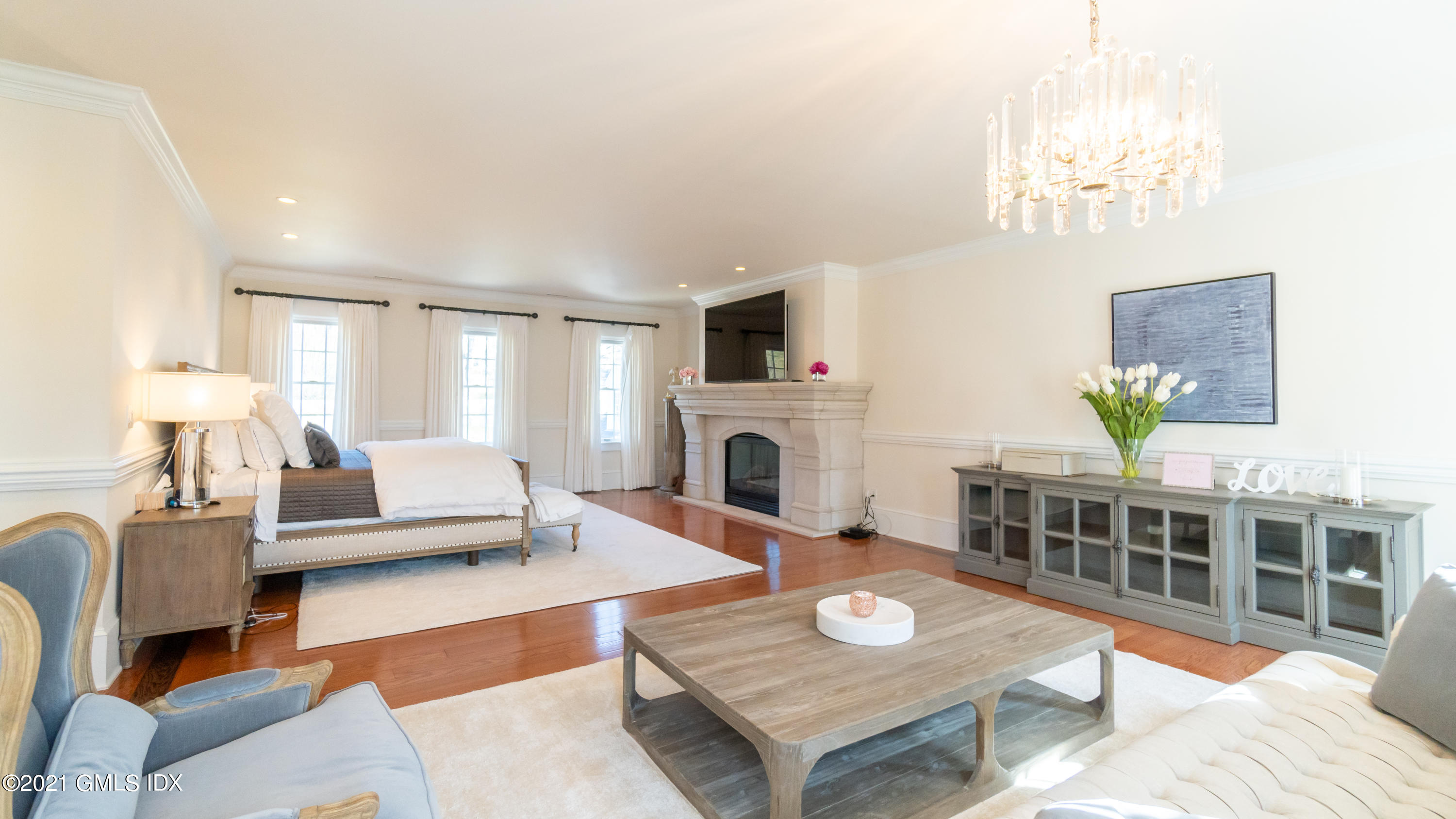 28 Dairy Road Greenwich, CT 06830 - Photo 23 of 23 a living room with furniture a fireplace and a chandelier
