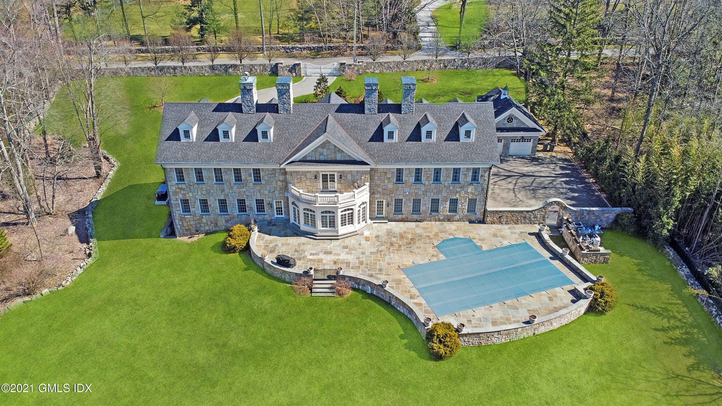 28 Dairy Road Greenwich, CT 06830 - Photo 3 of 23 a aerial view of a house with swimming pool garden and patio