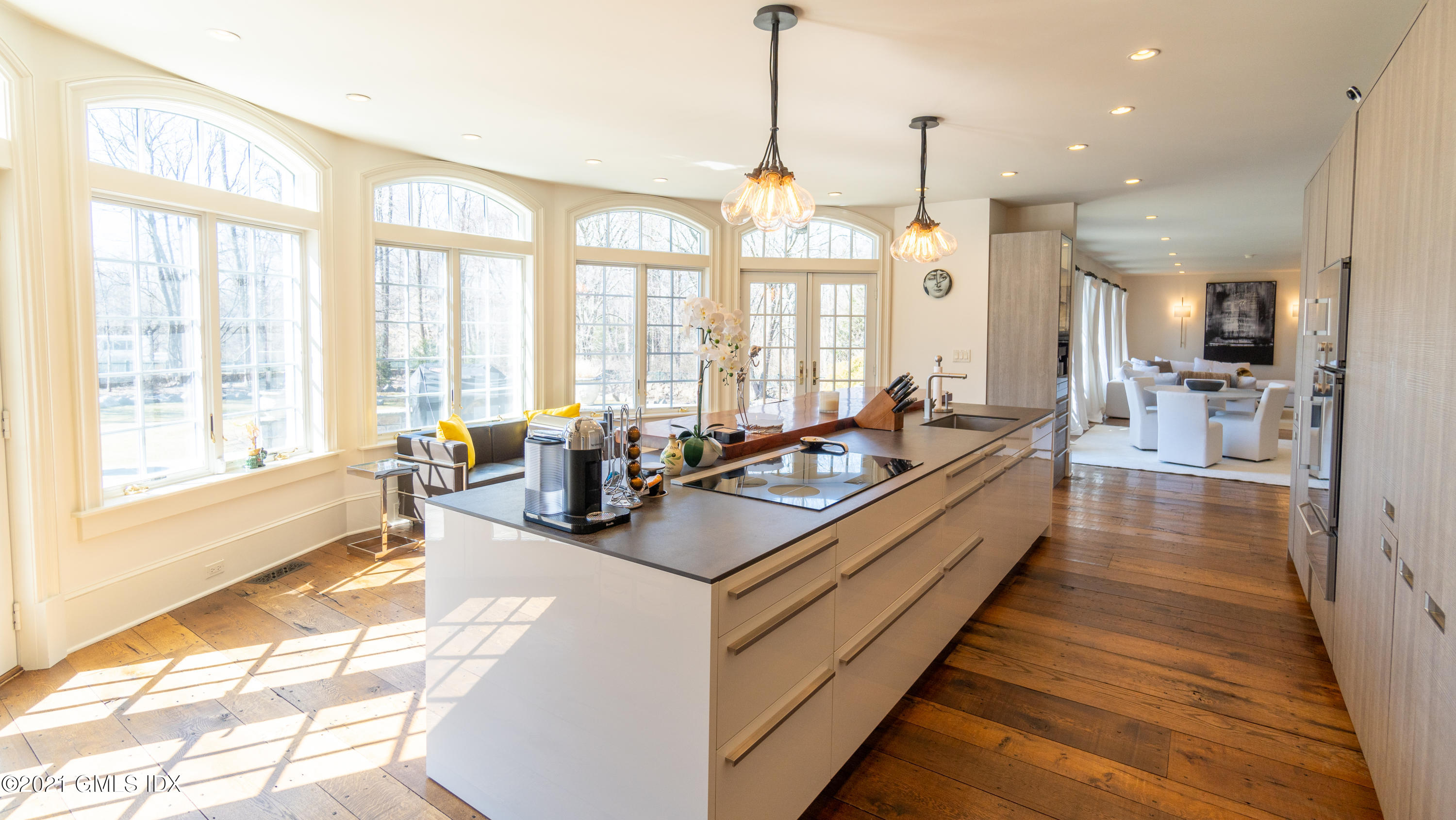 28 Dairy Road Greenwich, CT 06830 - Photo 7 of 23 a large kitchen with sink a counter top space and living room view