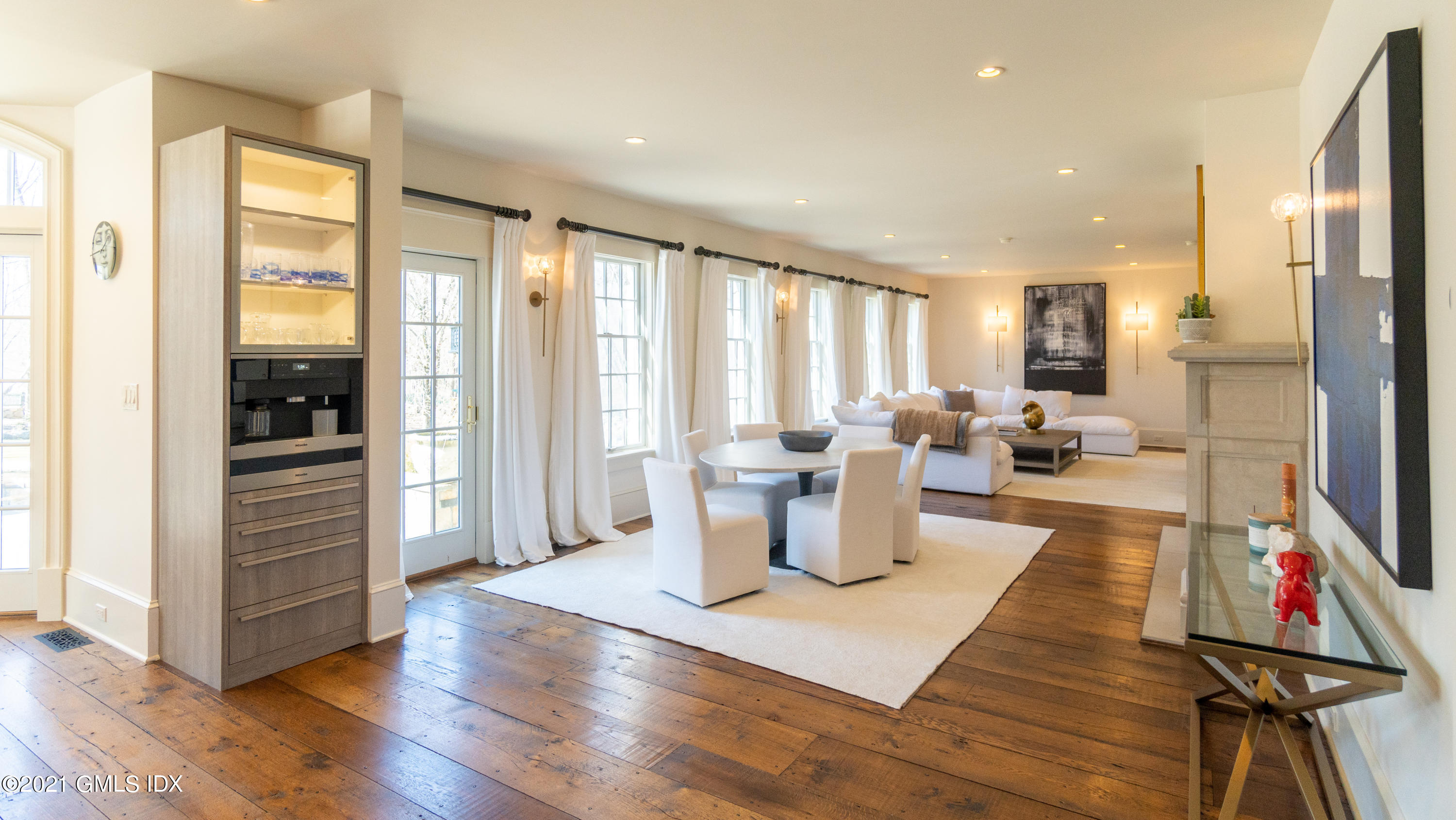 28 Dairy Road Greenwich, CT 06830 - Photo 8 of 23 a living room with furniture a large window and wooden floor