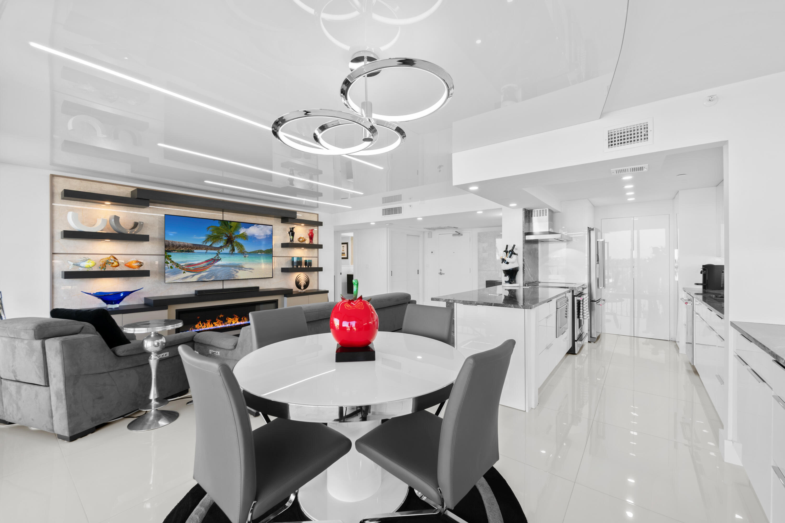 899 Jeffery Street, Unit 612 Boca Raton, FL 33487 - Photo 12 of 63 a kitchen with a dining table and chairs