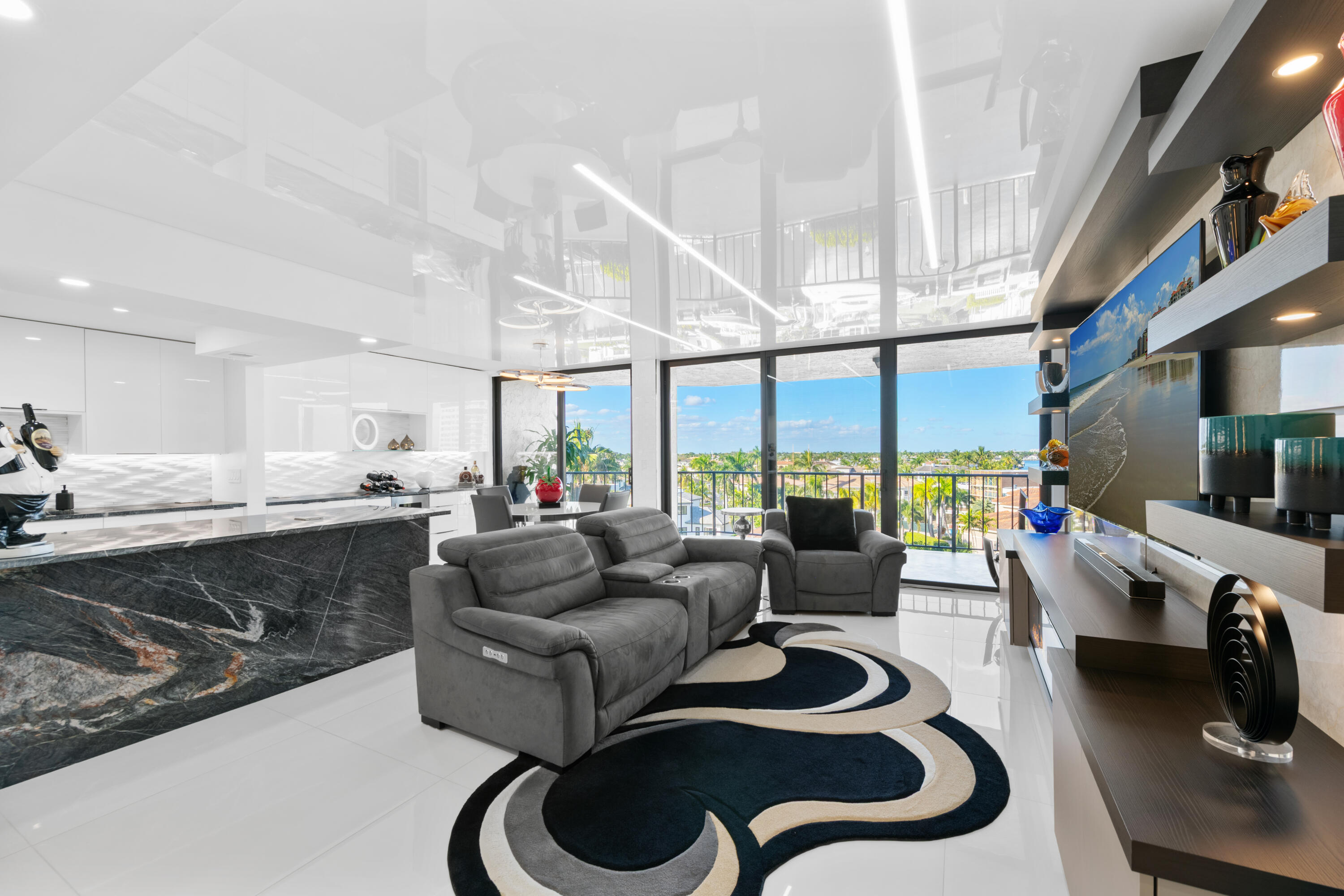 899 Jeffery Street, Unit 612 Boca Raton, FL 33487 - Photo 16 of 63 a living room with furniture and a flat screen tv