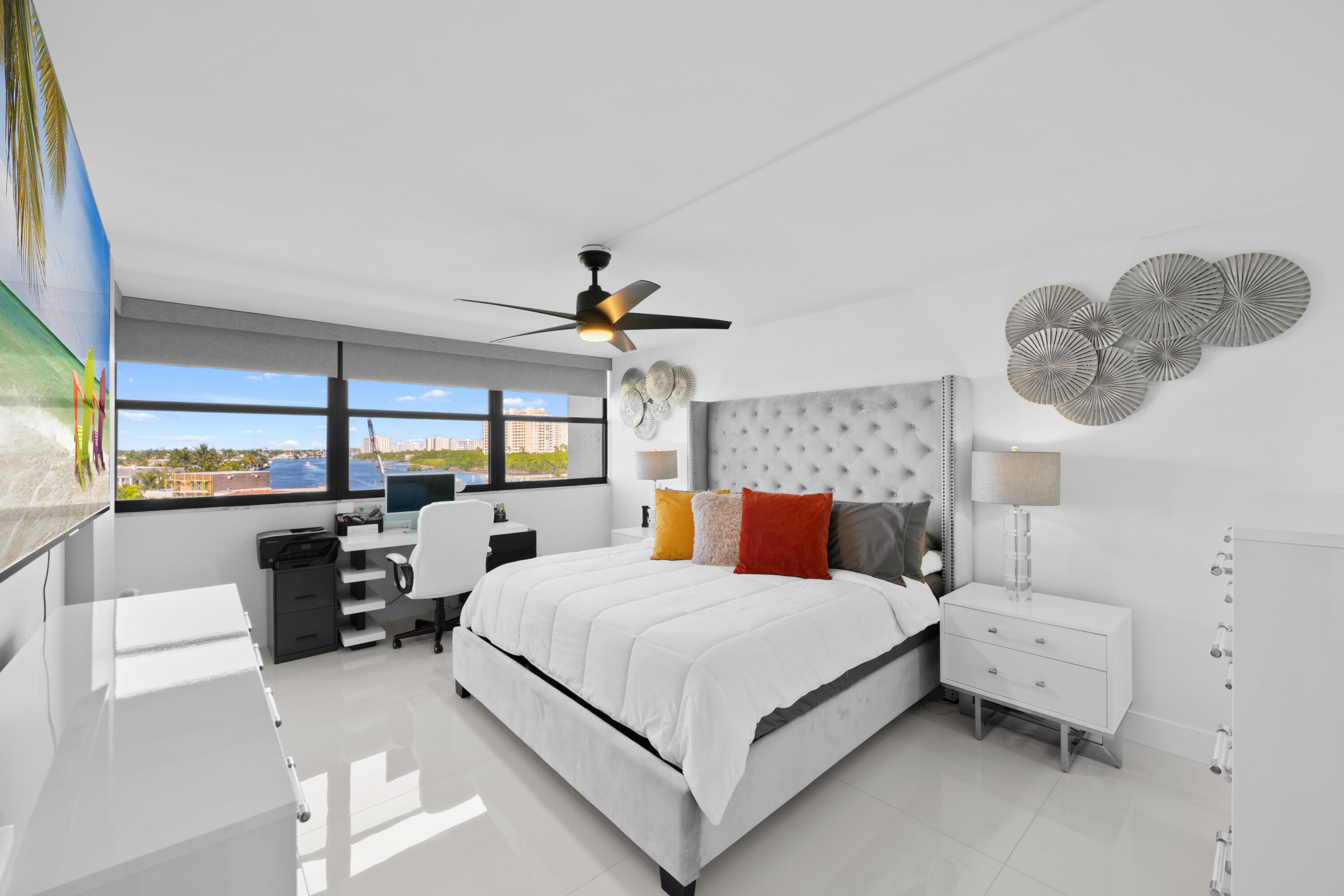 899 Jeffery Street, Unit 612 Boca Raton, FL 33487 - Photo 20 of 63 a bedroom with a large bed and a chandelier