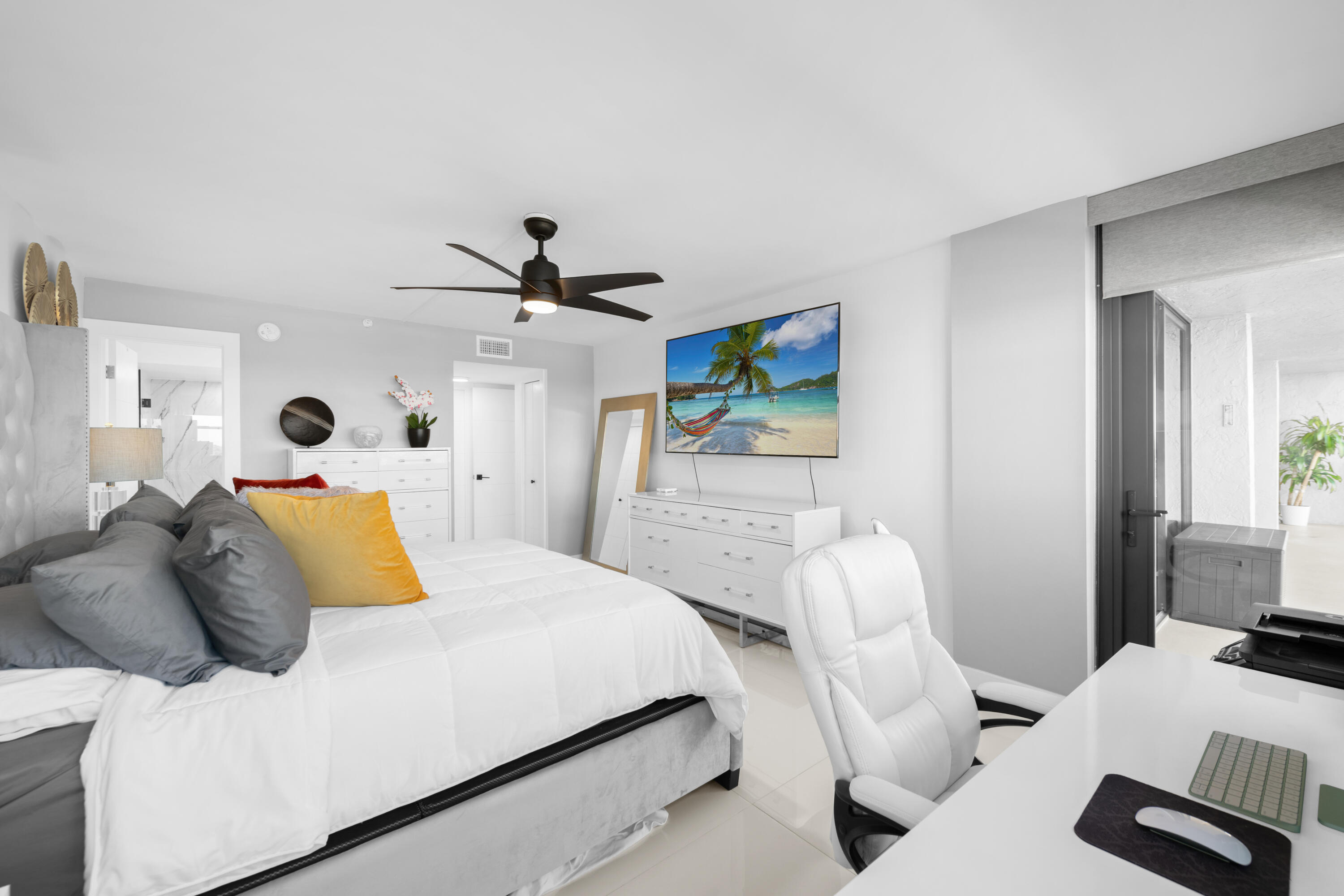 899 Jeffery Street, Unit 612 Boca Raton, FL 33487 - Photo 22 of 63 a bedroom with a bed and a flat screen tv