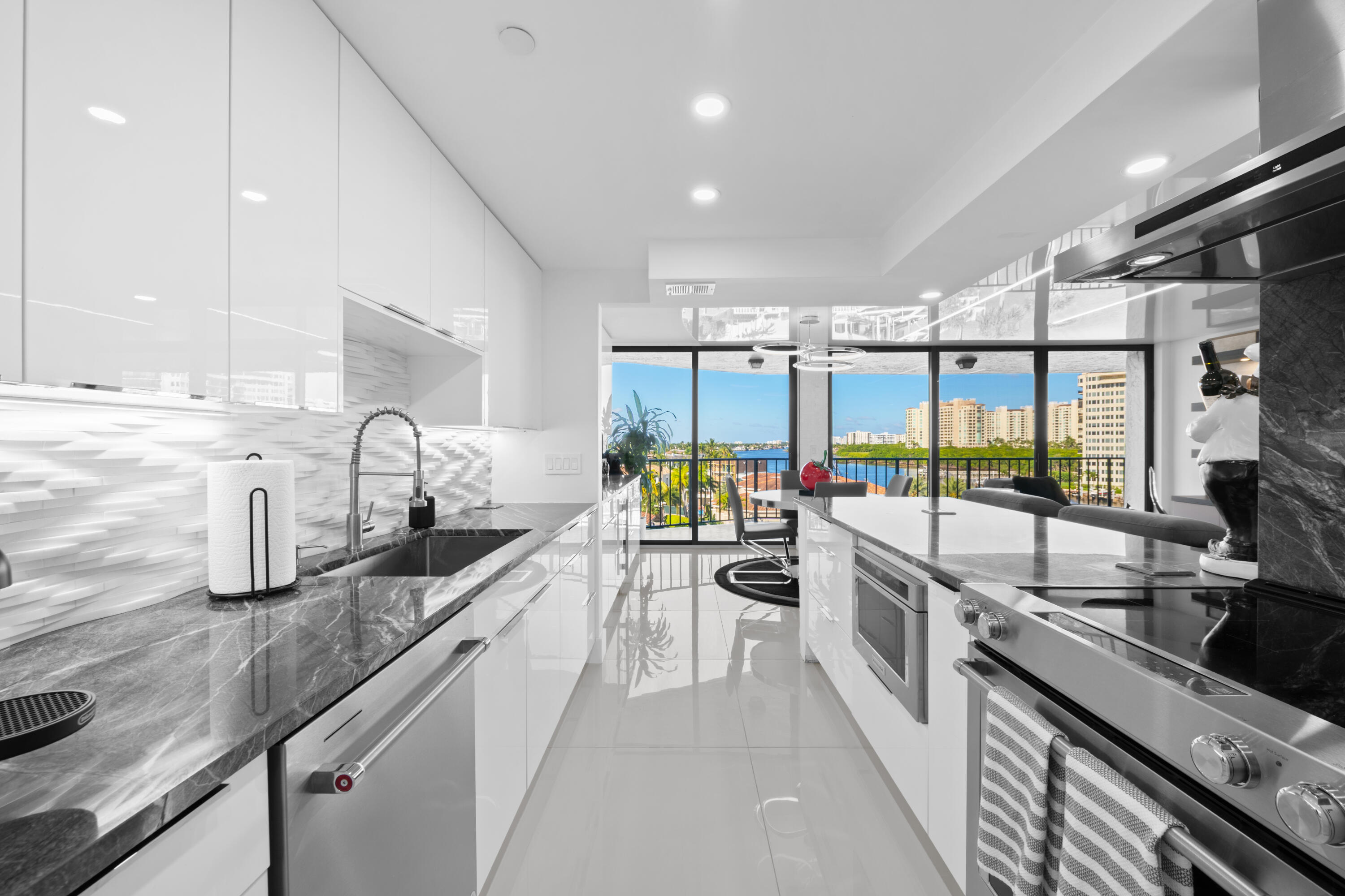 899 Jeffery Street, Unit 612 Boca Raton, FL 33487 - Photo 6 of 63 a large kitchen with lots of counter space a sink and appliances