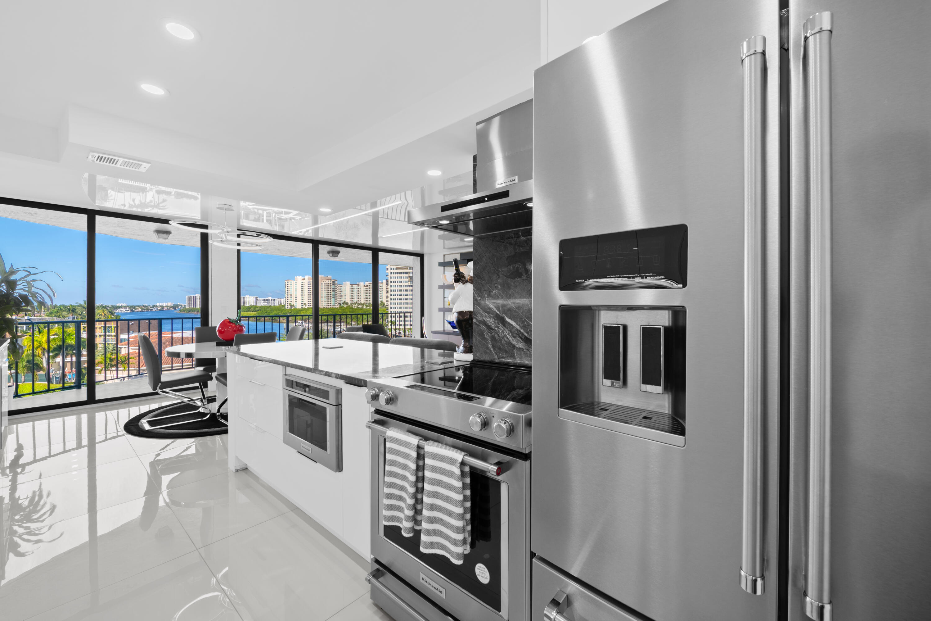 899 Jeffery Street, Unit 612 Boca Raton, FL 33487 - Photo 7 of 63 a kitchen with stainless steel appliances a stove refrigerator and a sink