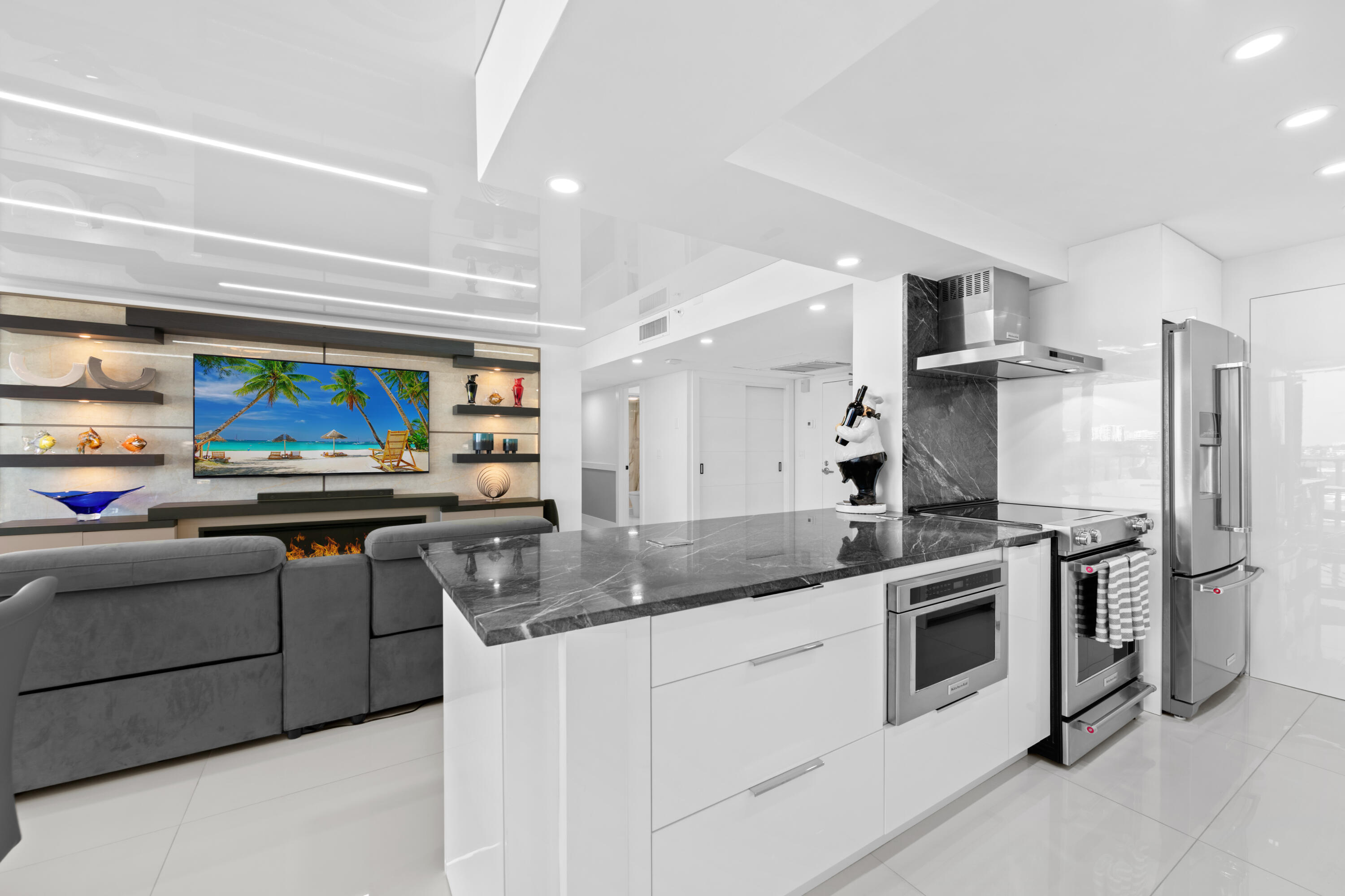 899 Jeffery Street, Unit 612 Boca Raton, FL 33487 - Photo 9 of 63 a kitchen with stainless steel appliances granite countertop a stove a sink and a refrigerator