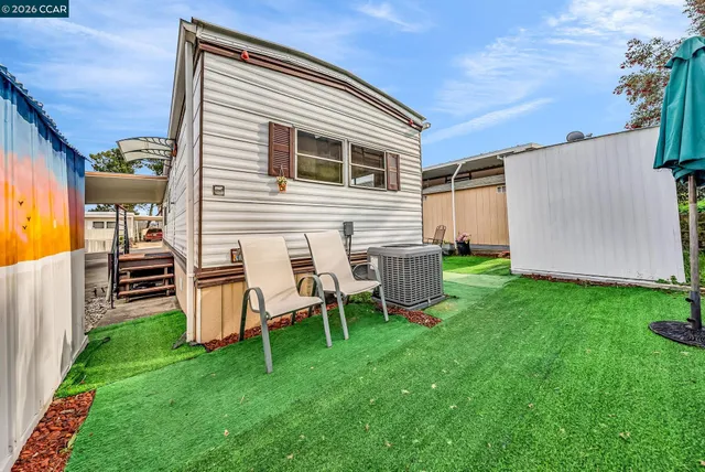 a patio with a table and chairs