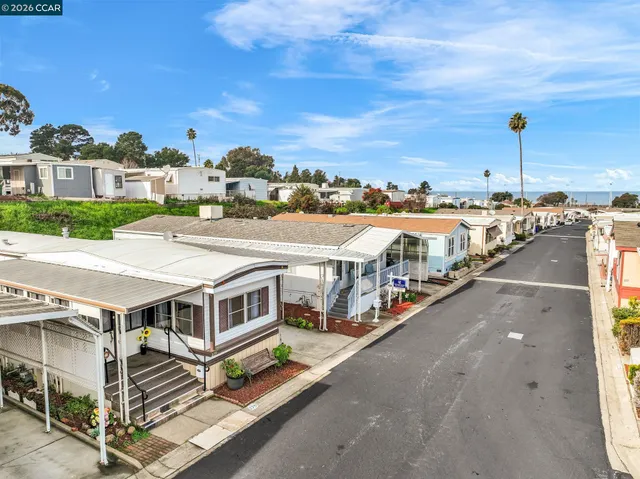a dining room with a table and chairs