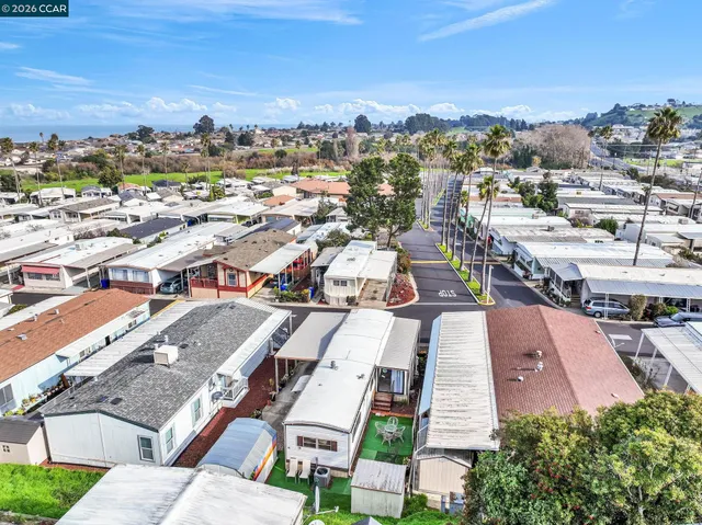 a kitchen with stainless steel appliances a refrigerator sink and cabinets