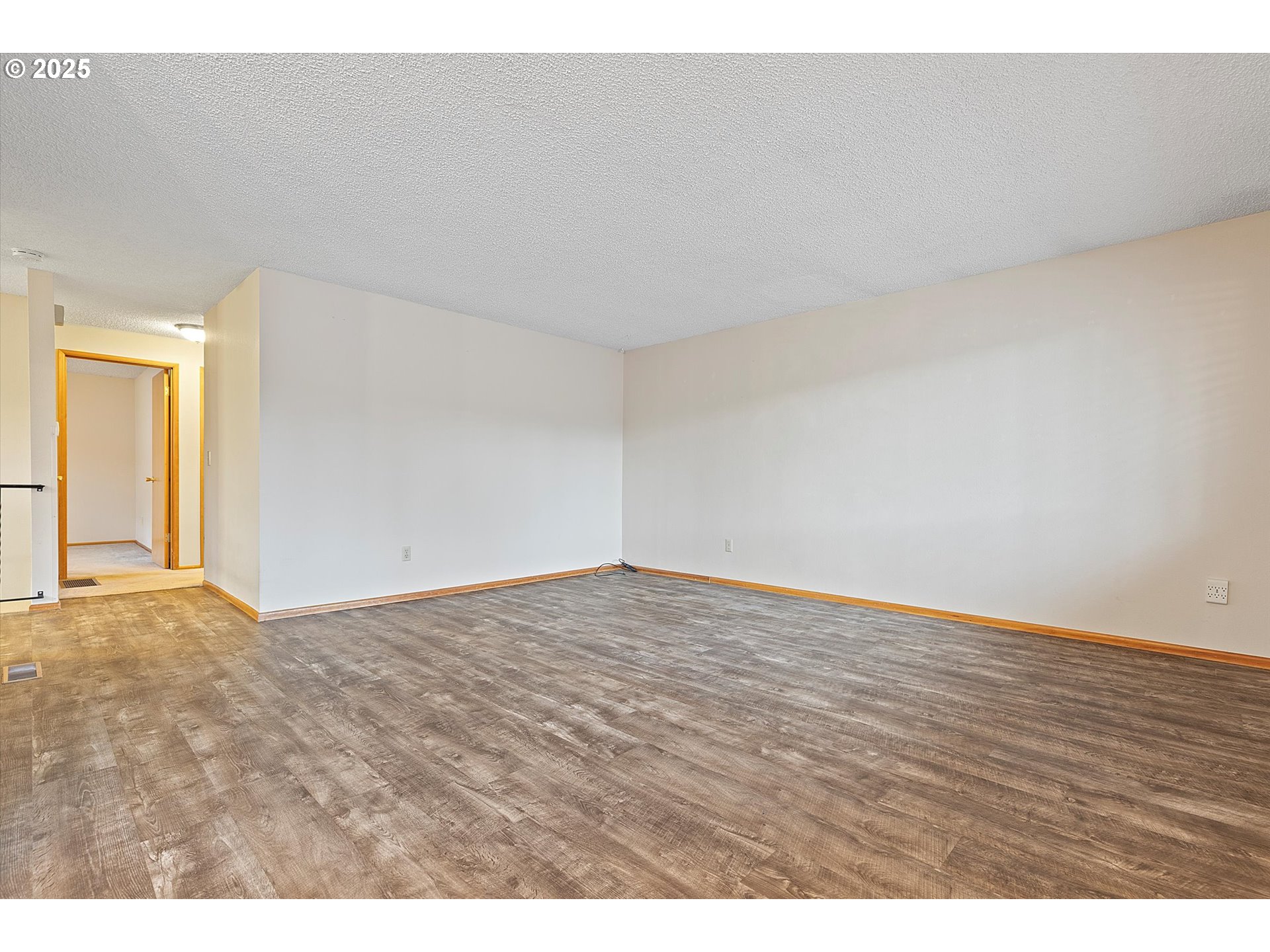 1295 Northwest Riverview Avenue Gresham, OR 97030 - Photo 11 of 35 a view of an empty room and wooden floor
