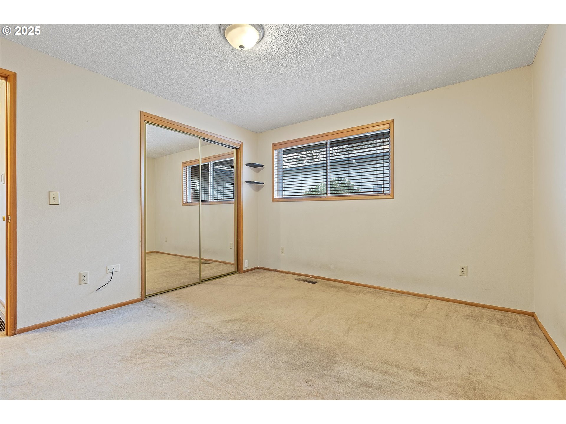 1295 Northwest Riverview Avenue Gresham, OR 97030 - Photo 16 of 35 a view of an empty room with wooden floor