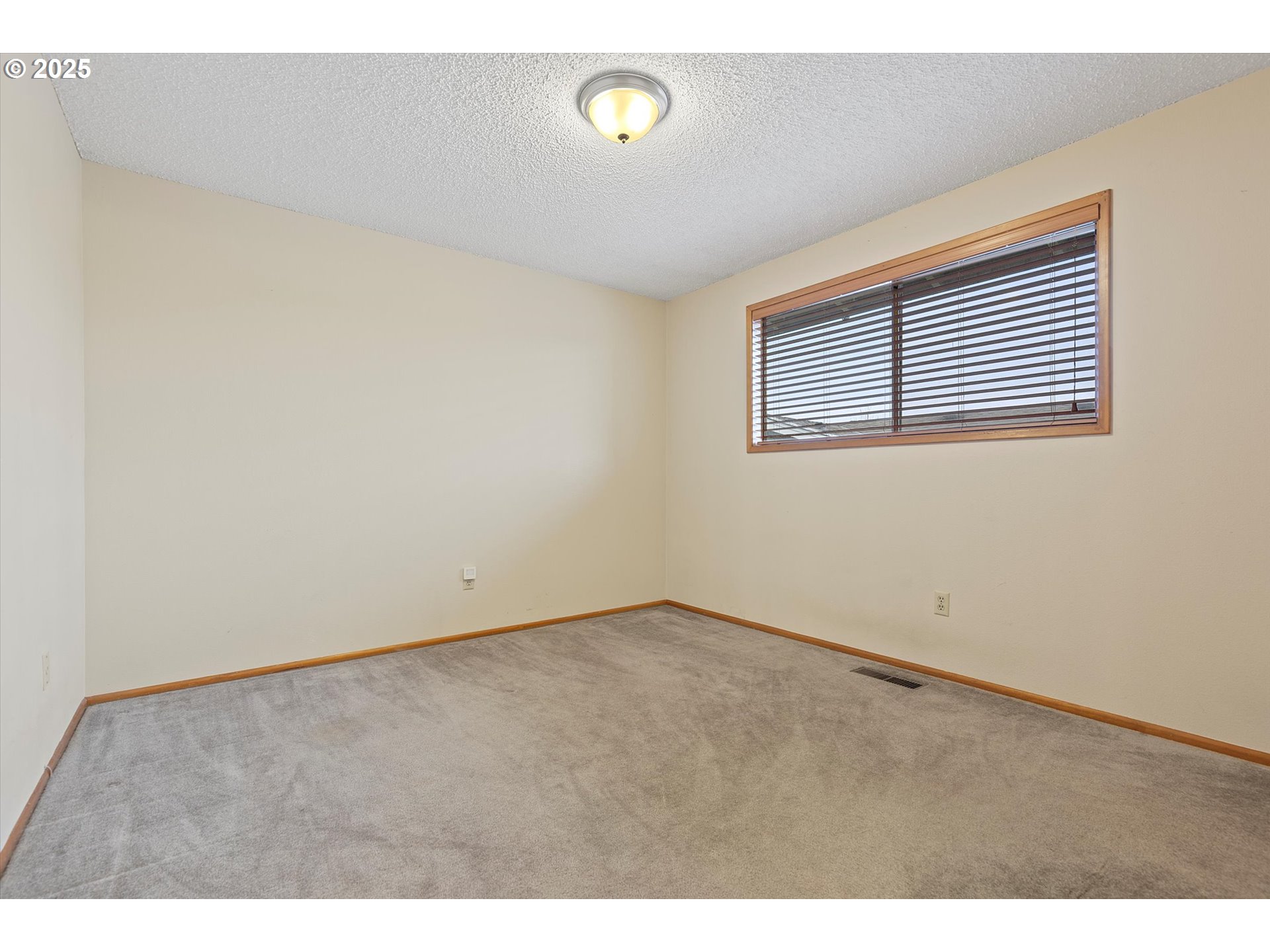 1295 Northwest Riverview Avenue Gresham, OR 97030 - Photo 19 of 35 a view of an empty room with a window
