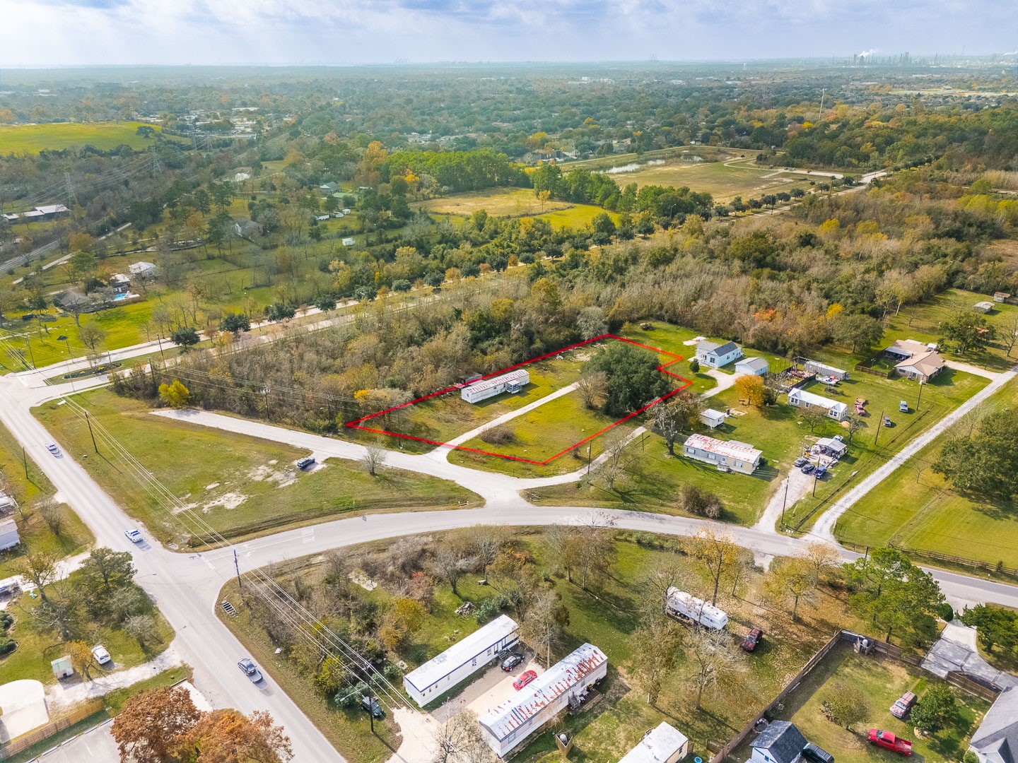 an aerial view of residential houses with outdoor space