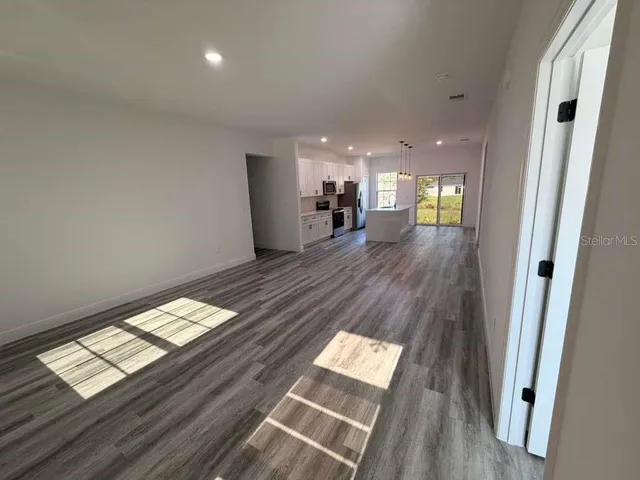 workspace with wooden floor and windows