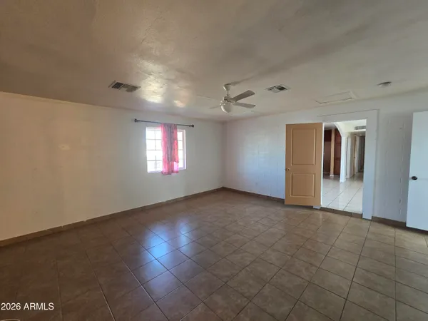a bedroom with a bed and window