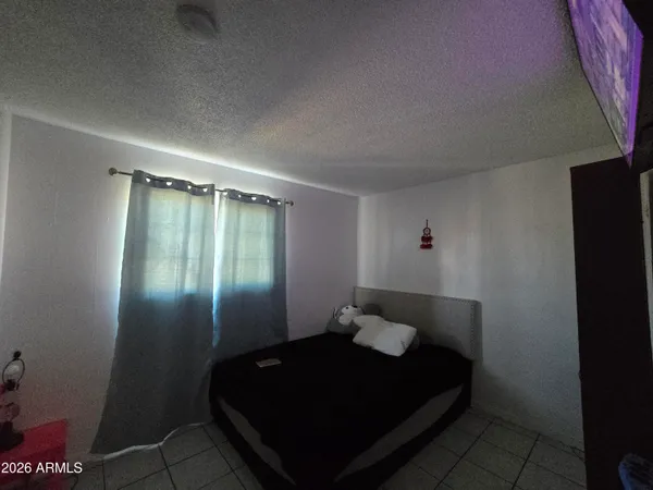 a backyard of a house with barbeque oven