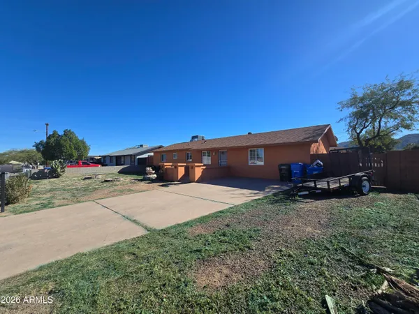 a view of a room with racks on the wall and a window