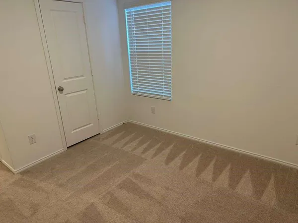 a view of a room that has a window in it