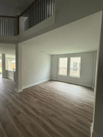 a large kitchen with granite countertop a stove a sink and a granite counter top