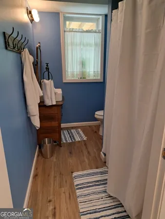 a view of entryway with wooden floor