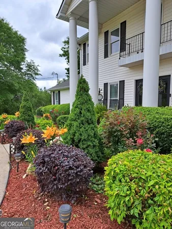 a house view with a garden space