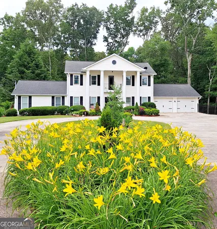 a front view of a house with swimming pool