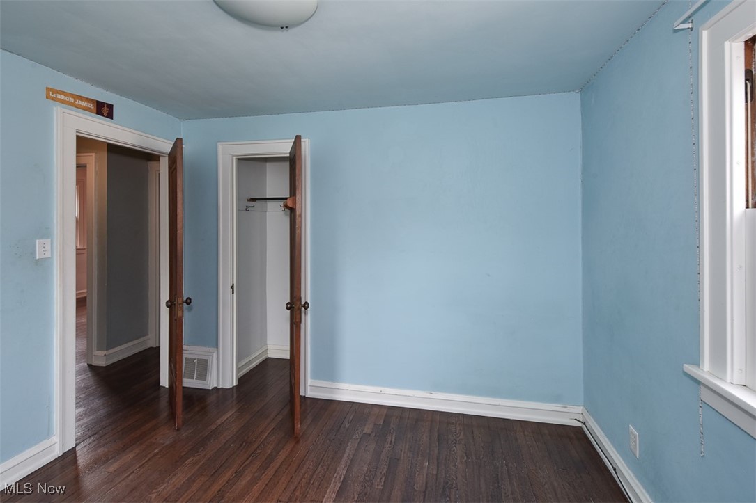 999 Pennfield Road Cleveland, OH 44121 - Photo 31 of 42 Unfurnished bedroom with dark hardwood / wood-style floors