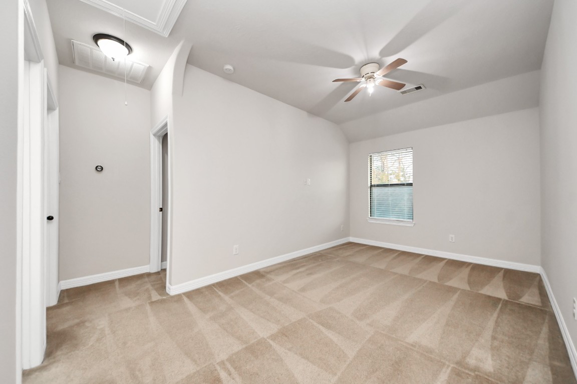 25122 Alina Lane Spring, TX 77386 - Photo 19 of 27 a view of an empty room with a fan