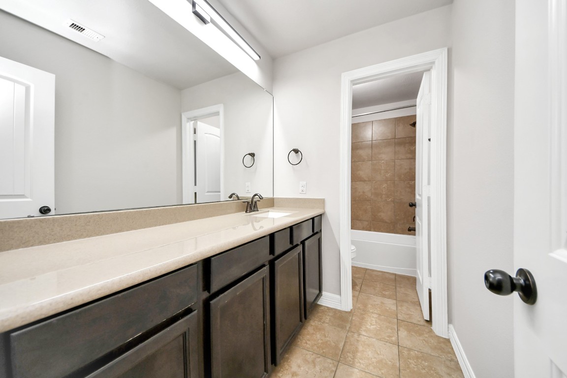 25122 Alina Lane Spring, TX 77386 - Photo 20 of 27 a bathroom with a sink and a mirror