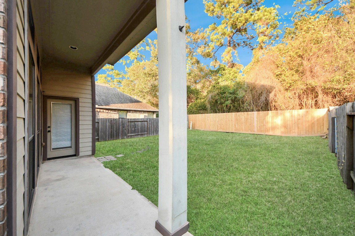 25122 Alina Lane Spring, TX 77386 - Photo 26 of 27 a view of a backyard with plants and a backyard