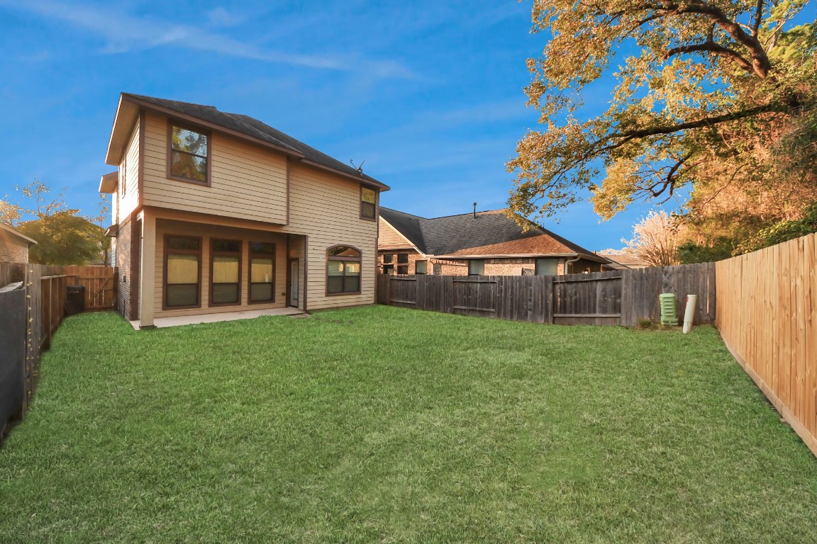 25122 Alina Lane Spring, TX 77386 - Photo 27 of 27 a view of a house with backyard and garden