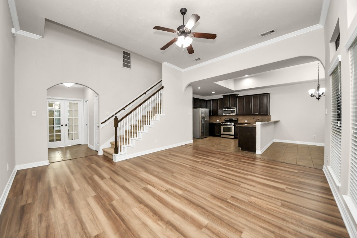 25122 Alina Lane Spring, TX 77386 - Photo 3 of 27 a view of empty room with wooden floor and a ceiling fan