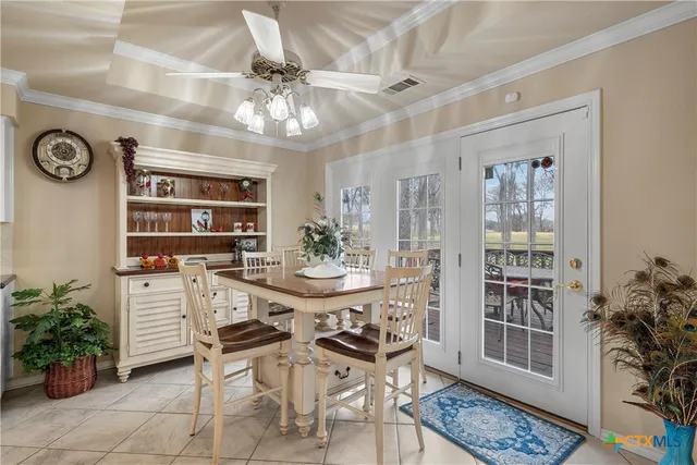 a large kitchen with a table and chairs
