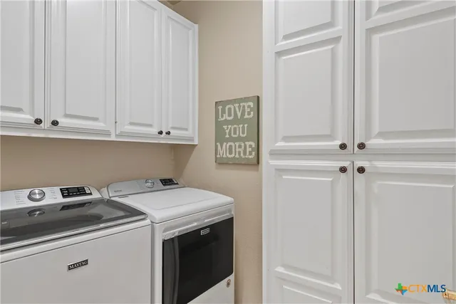 a spacious bedroom with a bed and a tv