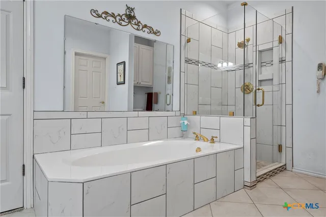 a bed room with a bed and a large window