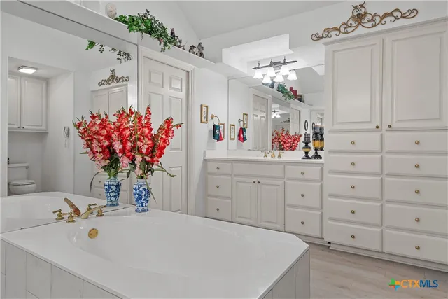 a bathroom with a bathtub and a sink