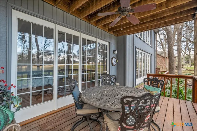 a view of a balcony with furniture