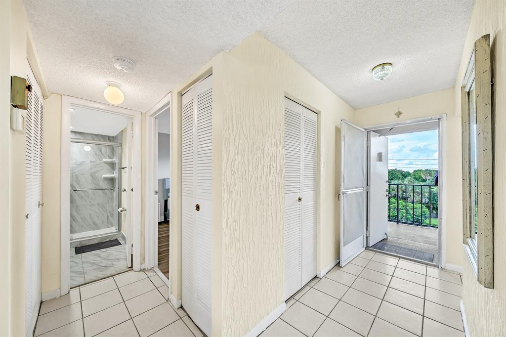 6200 Northwest 44th Street, Unit 405 Lauderhill, FL 33319 - Photo 12 of 44 a view of a bathroom with shower and window
