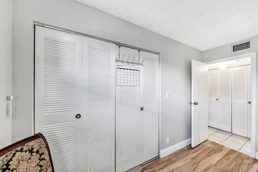 6200 Northwest 44th Street, Unit 405 Lauderhill, FL 33319 - Photo 15 of 44 a view of a bathroom with wooden floor and a sink
