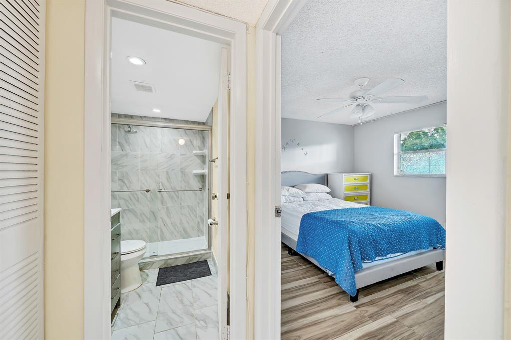 6200 Northwest 44th Street, Unit 405 Lauderhill, FL 33319 - Photo 16 of 44 a bedroom with a bed and a window