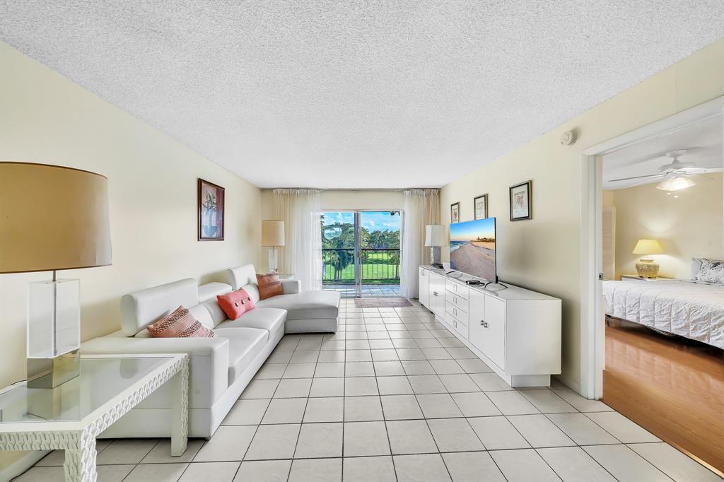 6200 Northwest 44th Street, Unit 405 Lauderhill, FL 33319 - Photo 20 of 44 a living room with furniture and a large window