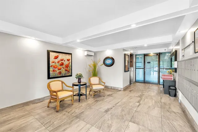 a view of a livingroom with furniture and a flat screen tv