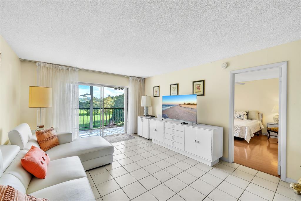 6200 Northwest 44th Street, Unit 405 Lauderhill, FL 33319 - Photo 21 of 44 a room with furniture and a large window