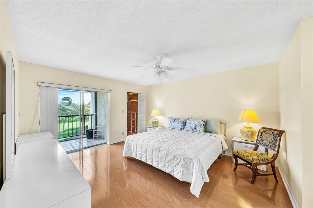 6200 Northwest 44th Street, Unit 405 Lauderhill, FL 33319 - Photo 22 of 44 a living room with a bed furniture and a large window