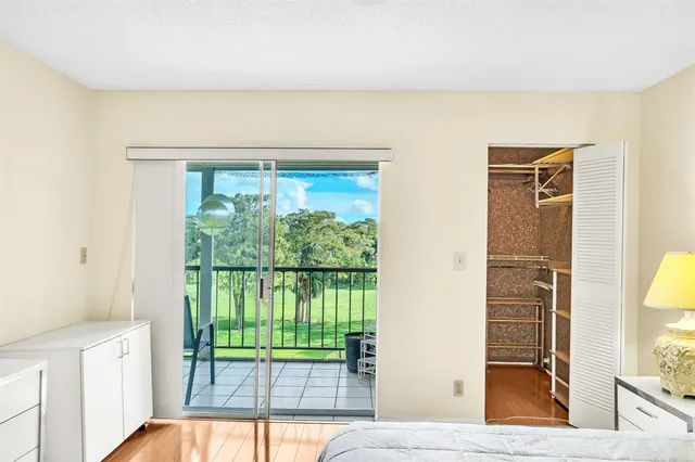 a view of a hardwood floor and a window