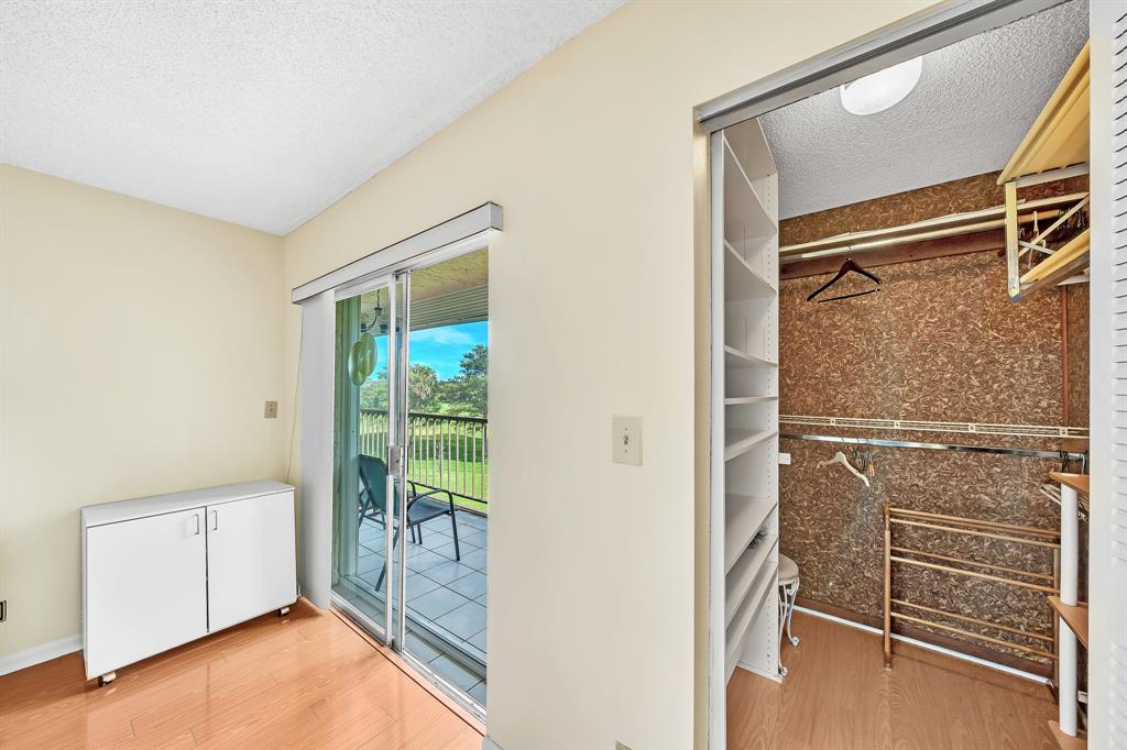 6200 Northwest 44th Street, Unit 405 Lauderhill, FL 33319 - Photo 24 of 44 a view of walk in closet with empty racks