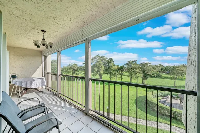 a view of a balcony with furniture