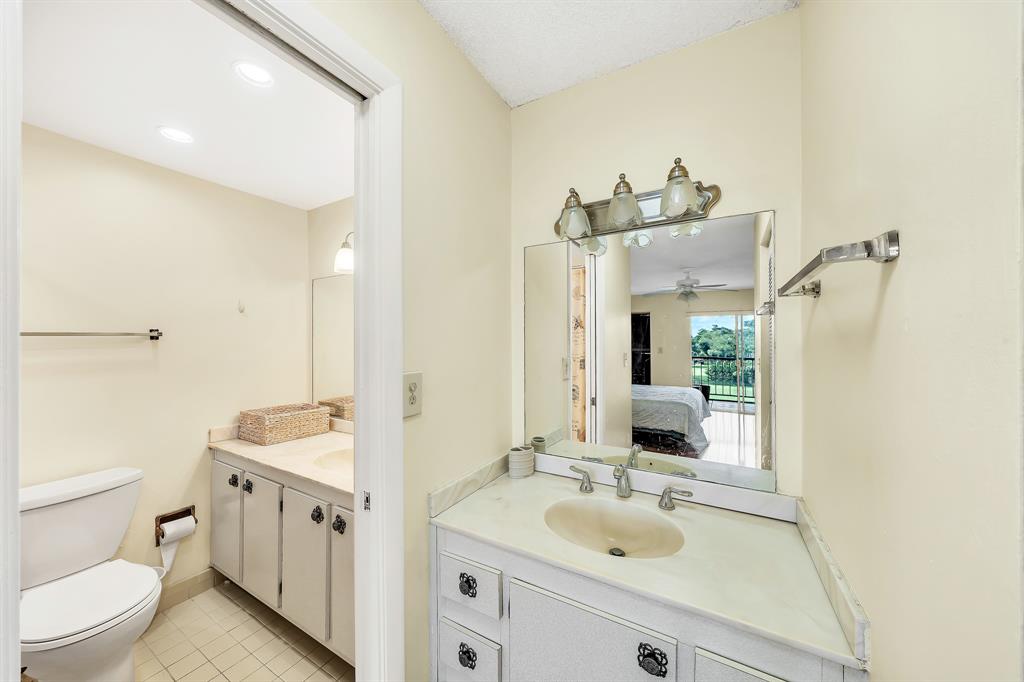 6200 Northwest 44th Street, Unit 405 Lauderhill, FL 33319 - Photo 29 of 44 a bathroom with a sink and a toilet
