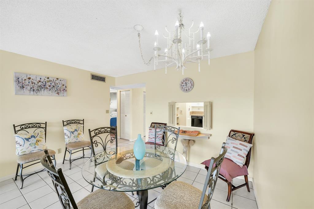 6200 Northwest 44th Street, Unit 405 Lauderhill, FL 33319 - Photo 39 of 44 a view of a dining room with furniture